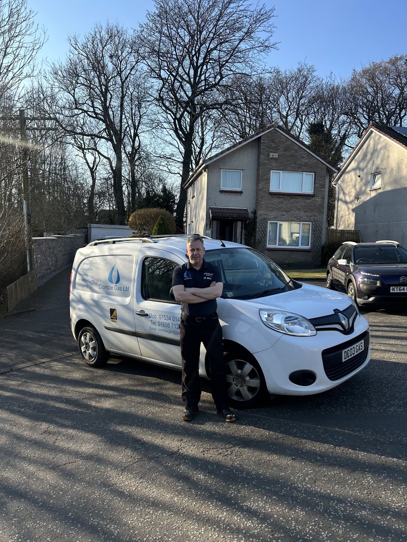 David Crombie, owner and engineer, standing beside the Crombie Gas van in Uddingston